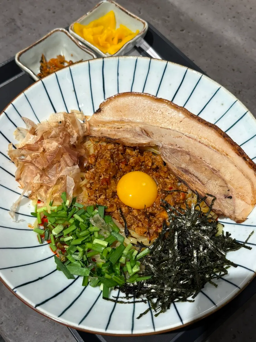 Mazesoba topped with pork belly and egg yolk