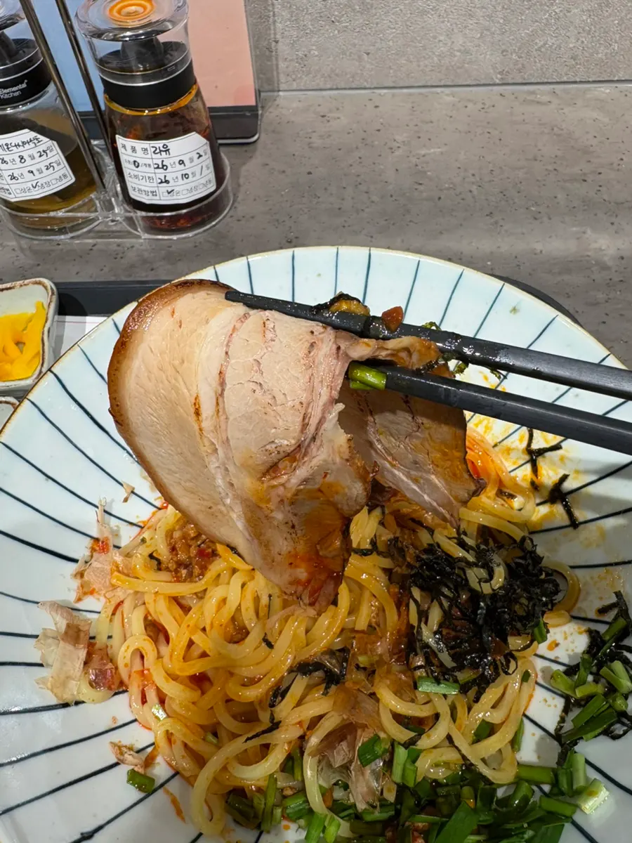 Mazesoba noodles mixed with the popped egg yolk