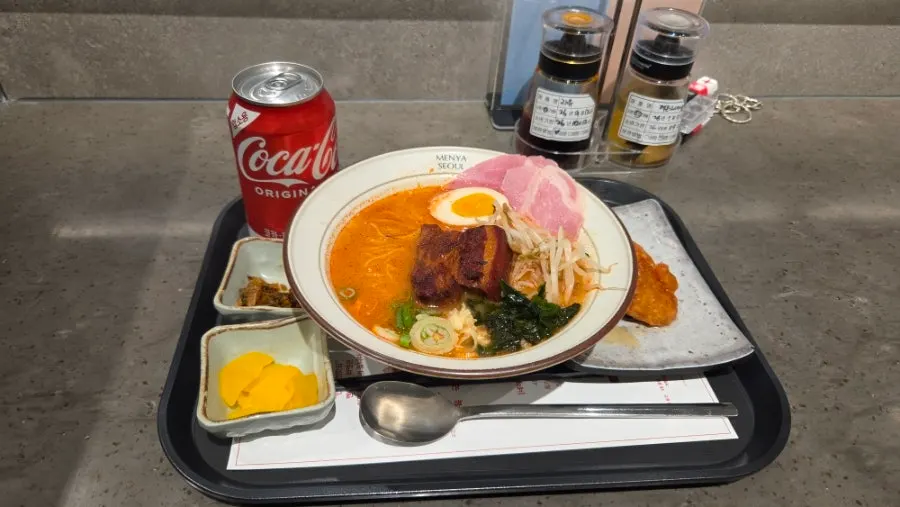 Spicy dongpo pork char siu ramen topped with large chunks of pork
