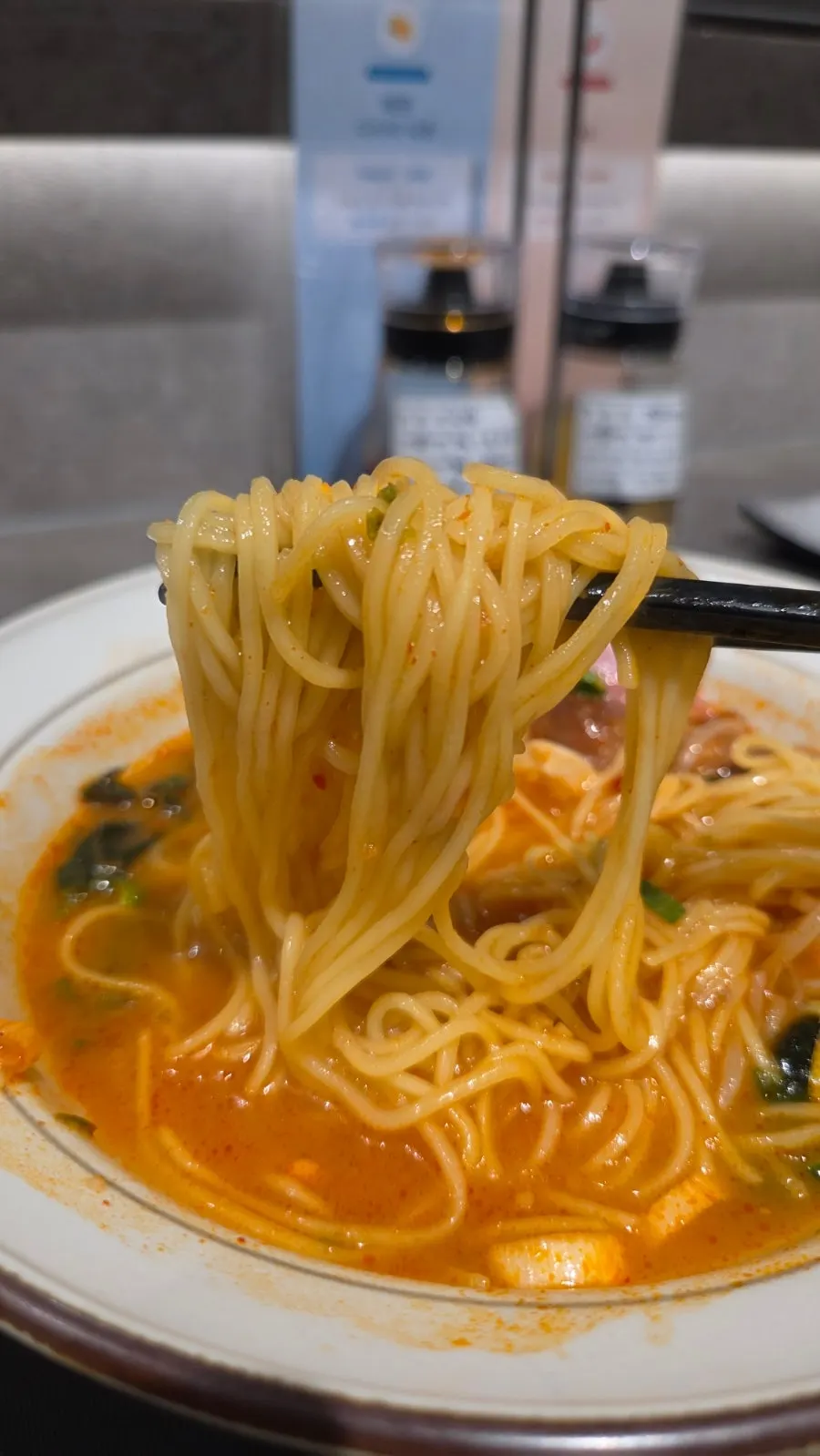 A bowl of spicy dongpo pork char siu ramen