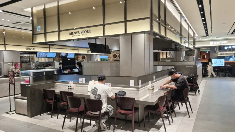 Storefront view of Menya Seoul in the basement 1F food court of Lotte Department Store Incheon