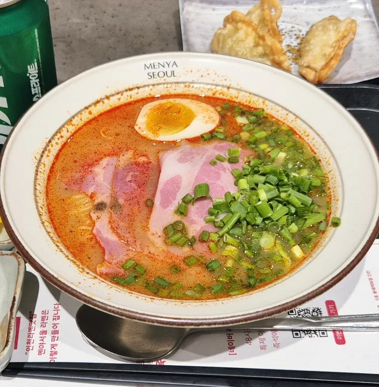 Ramen noodles lifted with chopsticks