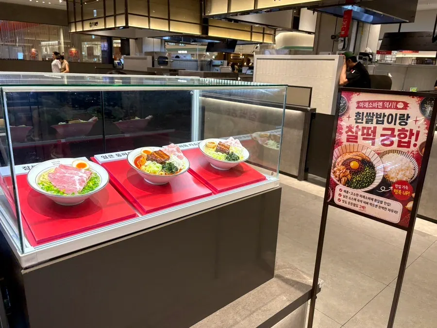Ramen models displayed in front of the register at Menya Seoul