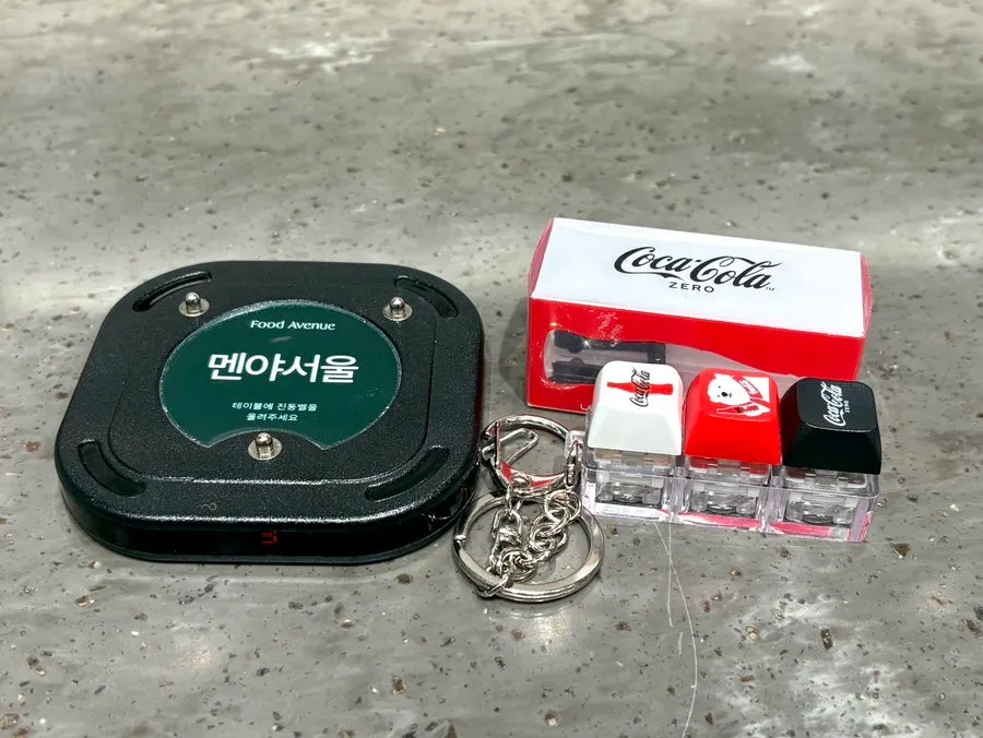Buzzer and Coca-Cola keycap keyring received after ordering