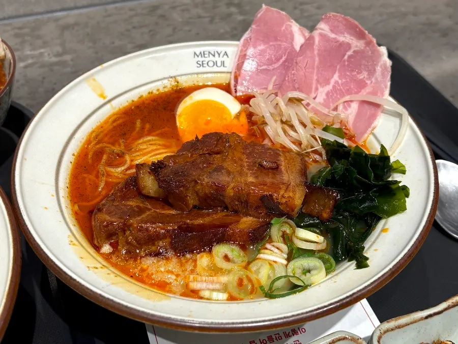 Close-up of the dongpo pork mala broth ramen double single dish