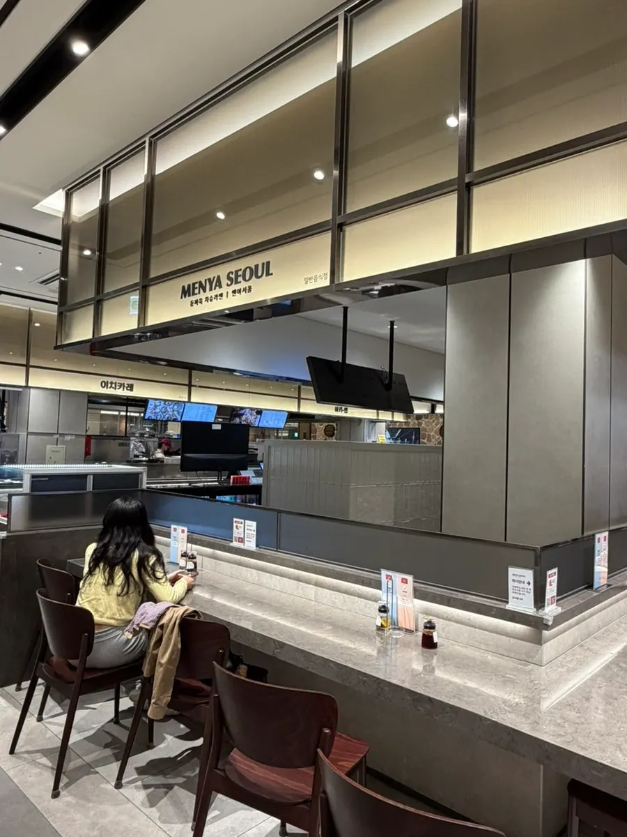 Open food-court-style seating at Menya Seoul