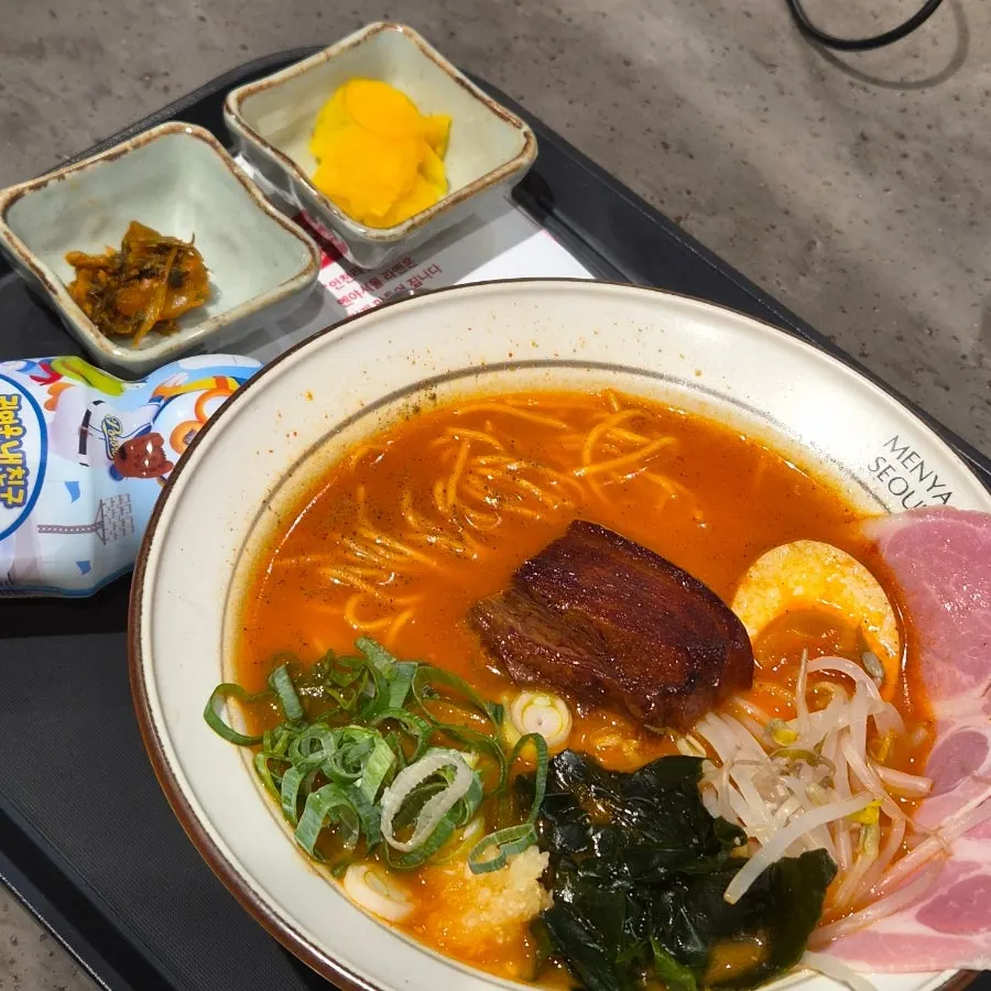 Full spread of spicy ramen, pork belly mazesoba, and karaage