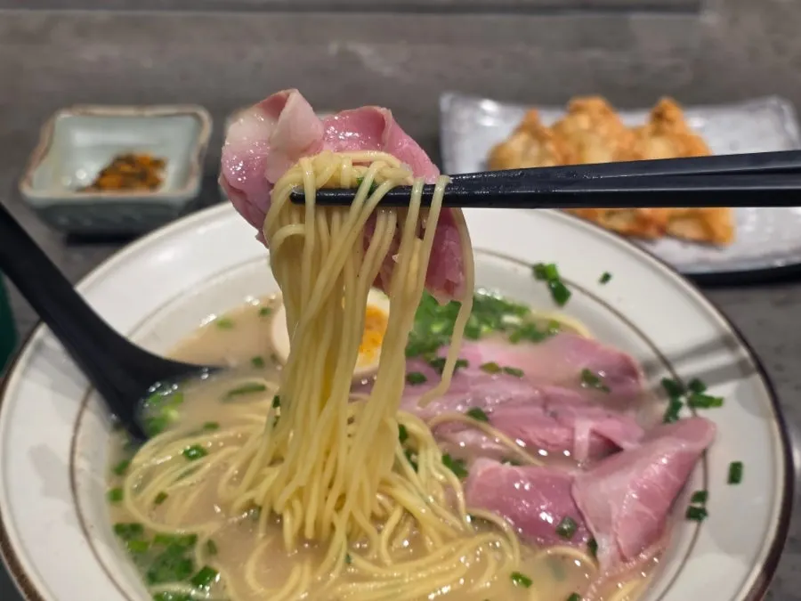 Close-up of noodles soaked in broth