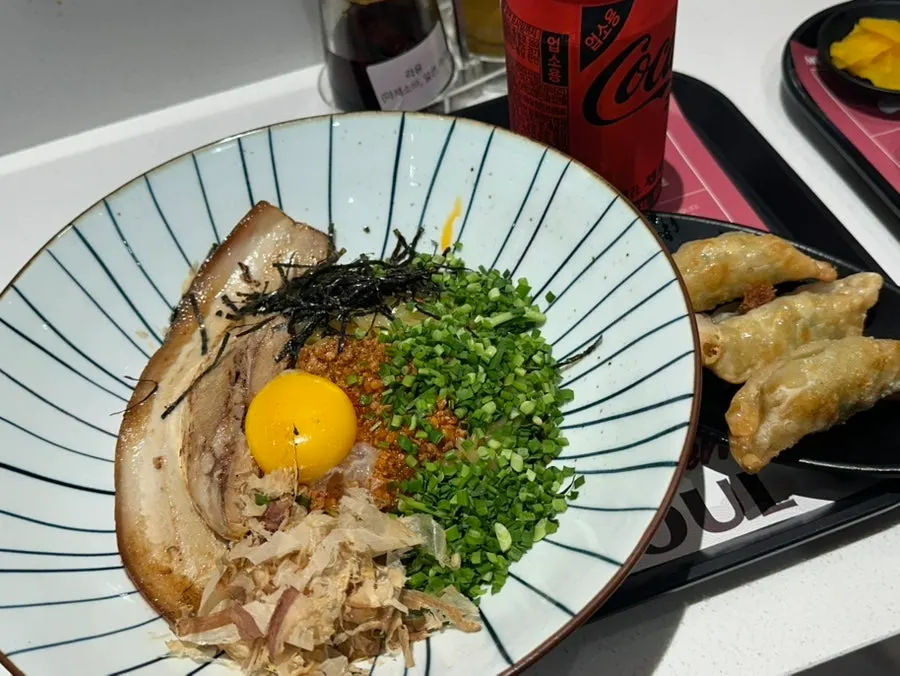 Pork belly mazesoba set topped with an egg yolk