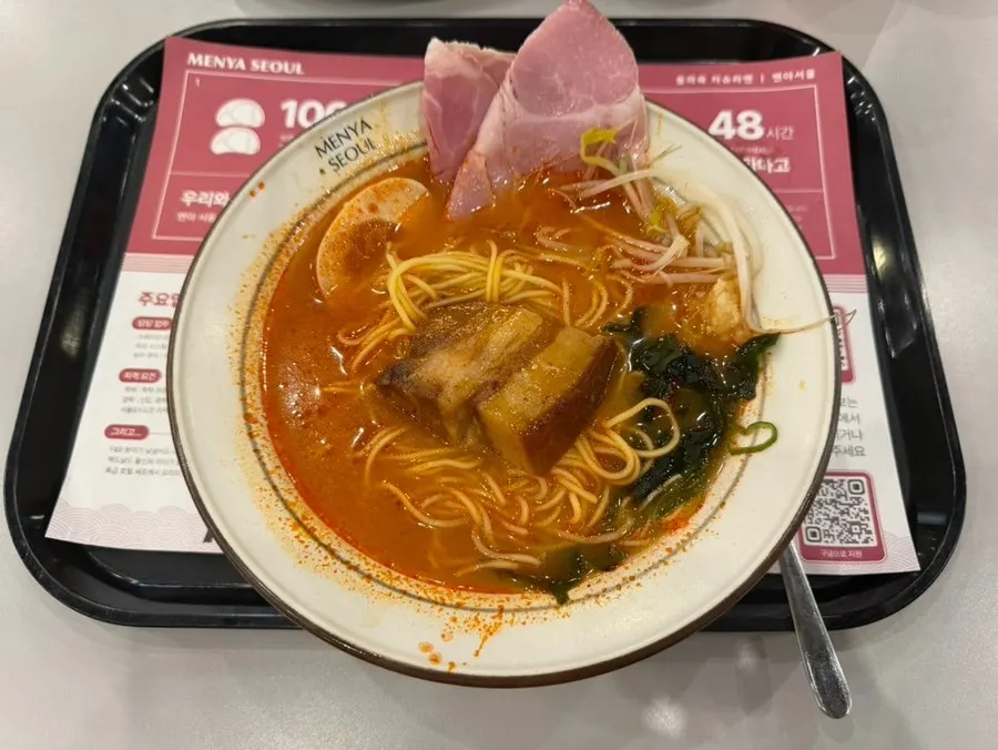 Crispy gyoza, pickled radish, and drink served as a set