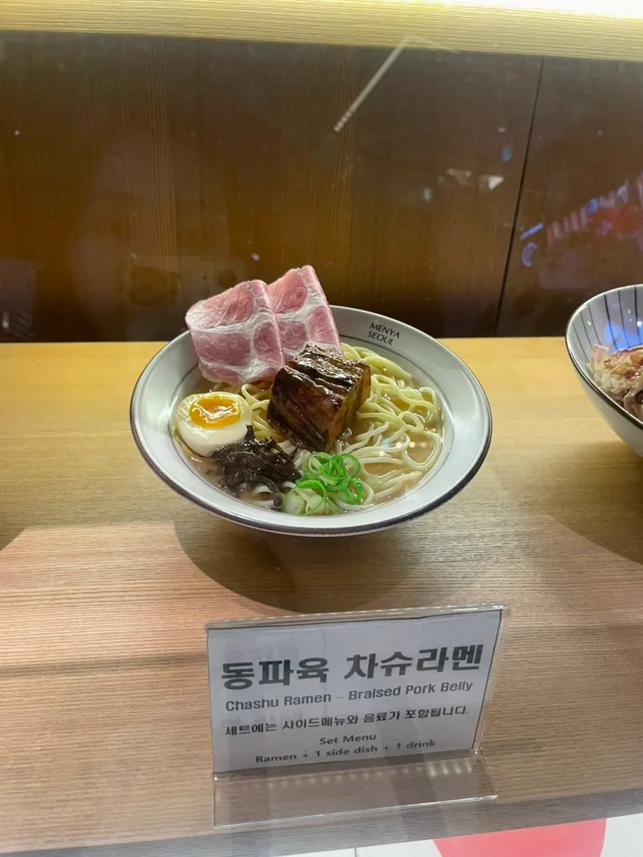 Menu listing dongpo pork and jambon toppings with broth options