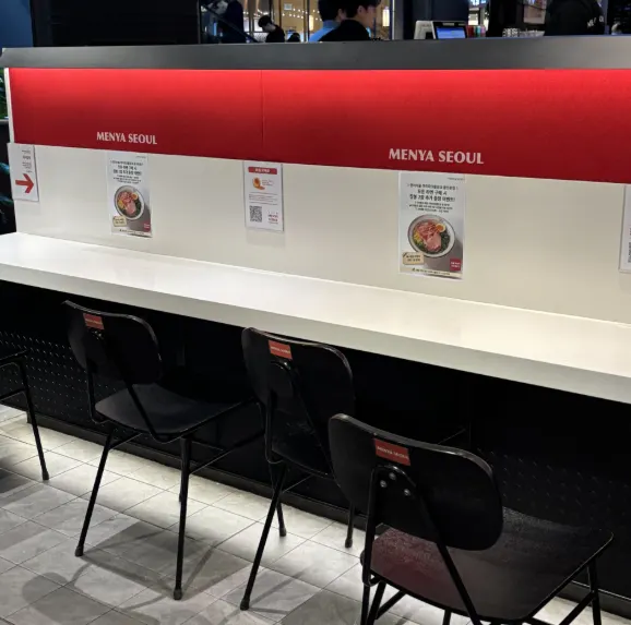 BAR seating set up at the center of the store