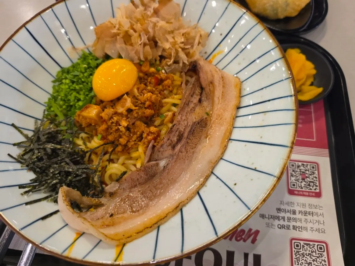A bowl of Menya Seoul's pork belly mazesoba