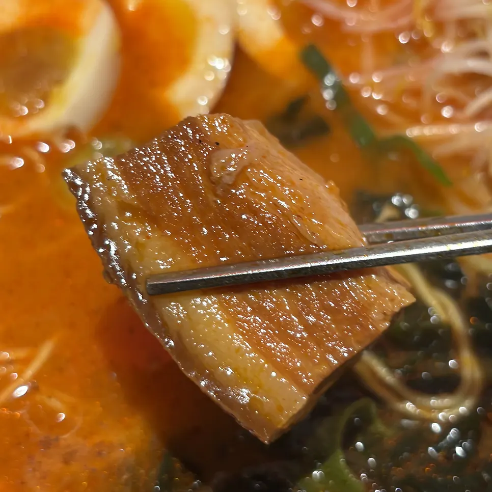 The thick dongpo pork placed on top of the ramen