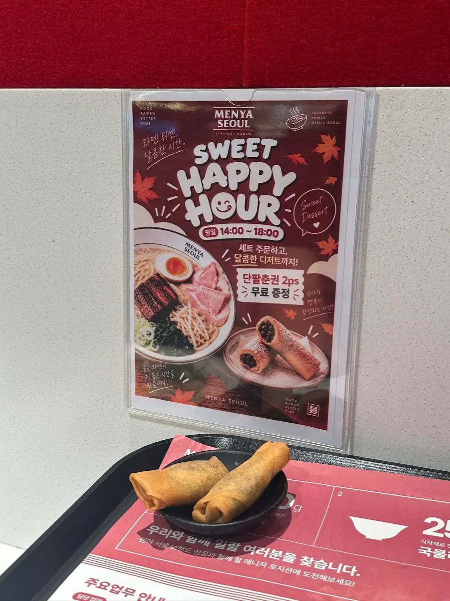 Table with gyoza and ramen side by side
