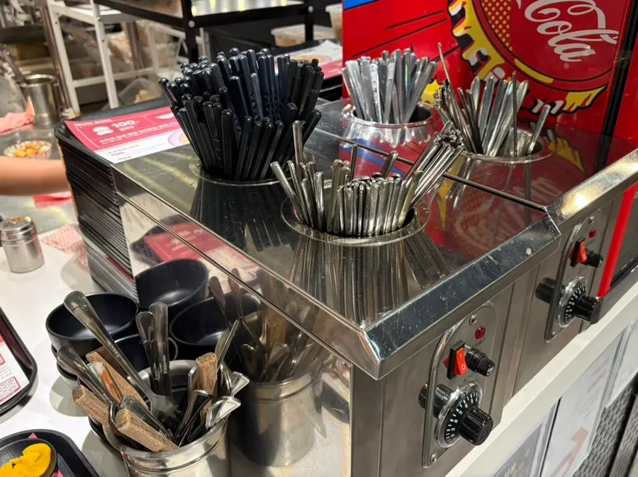 Buzzer and utensil pickup corner