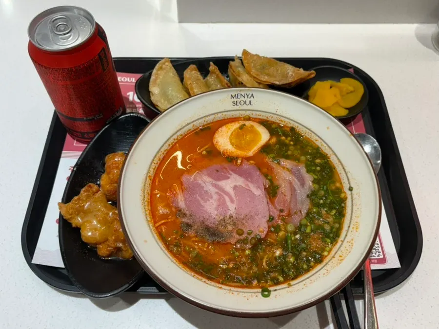 A bowl of ramen piled high with toppings