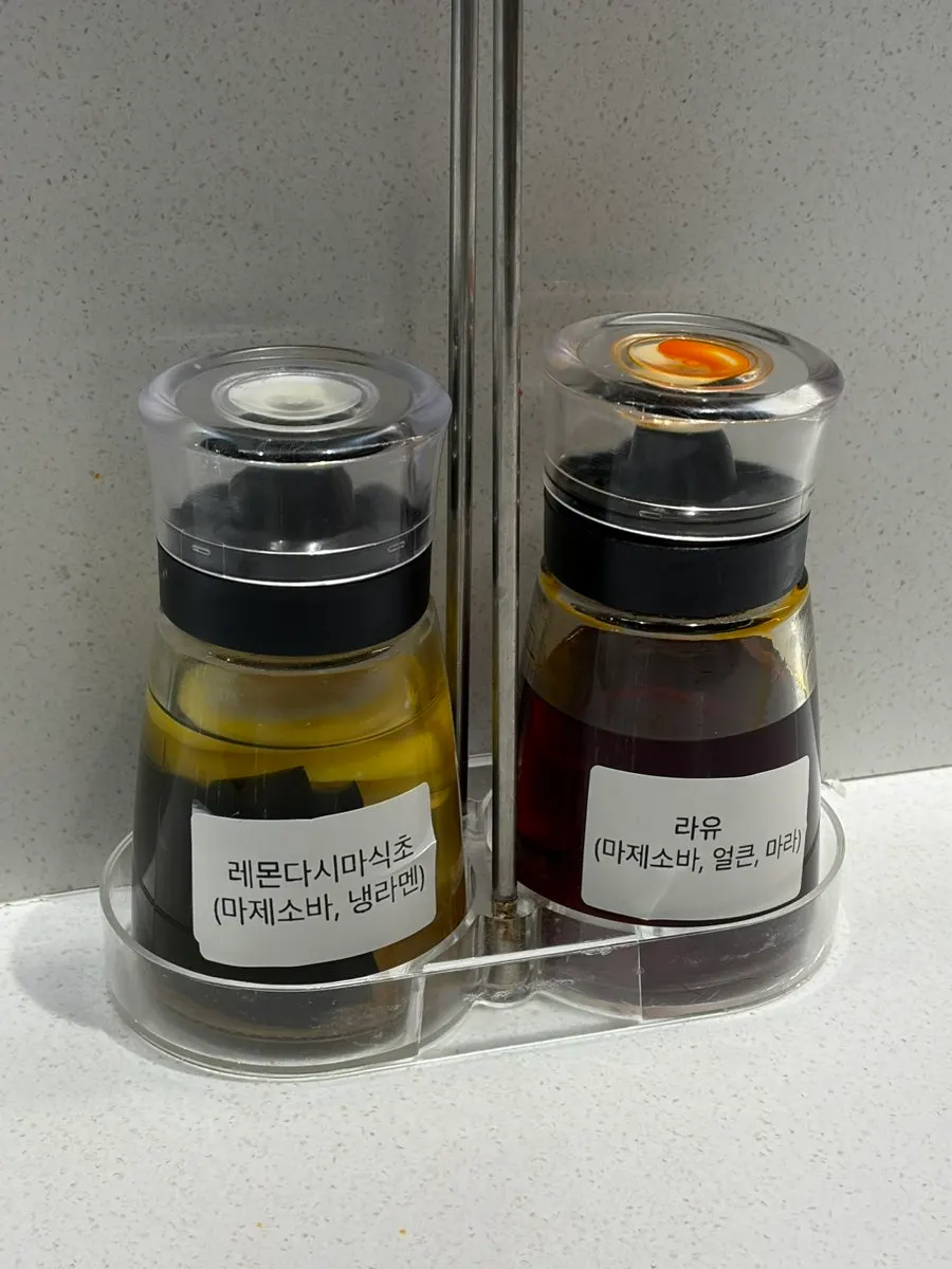 Rayu and vinegar sauces placed on the table