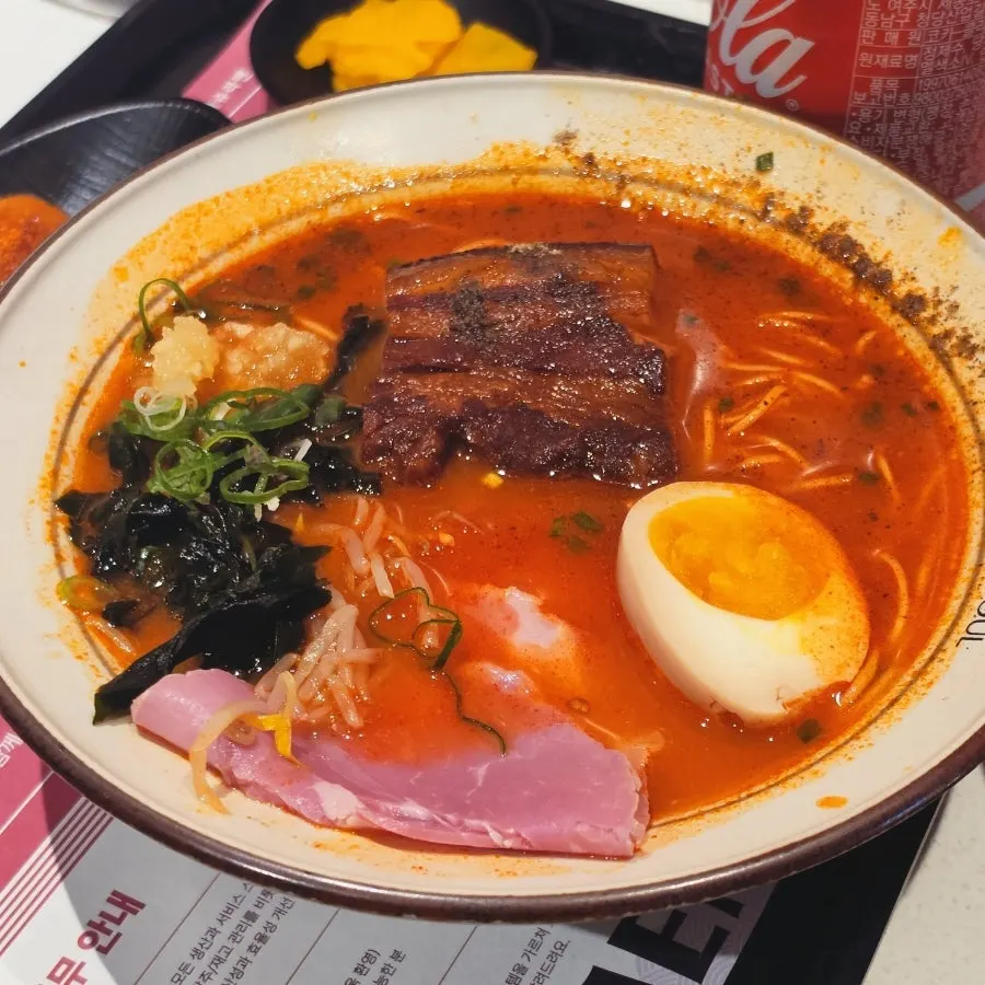 Spicy ramen topped with thick dongpo pork chashu