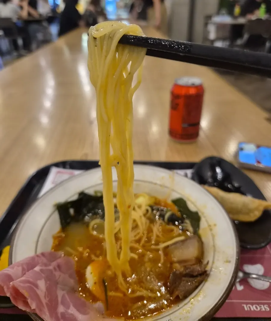 Noodles lifted up from the mala ramen