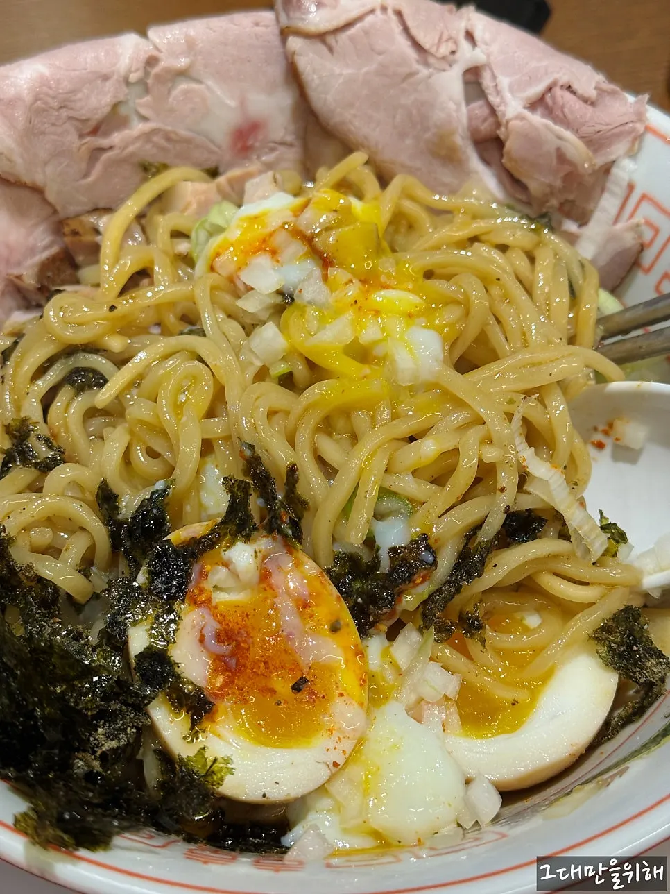 Chashu and noodles in the shoyu ramen