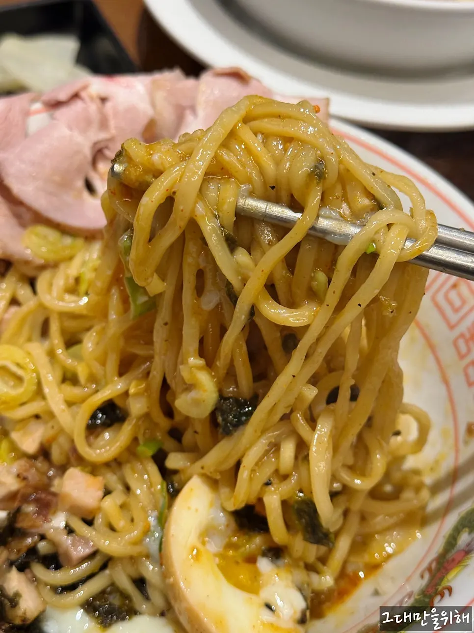 Abura soba mixed with a burst poached egg