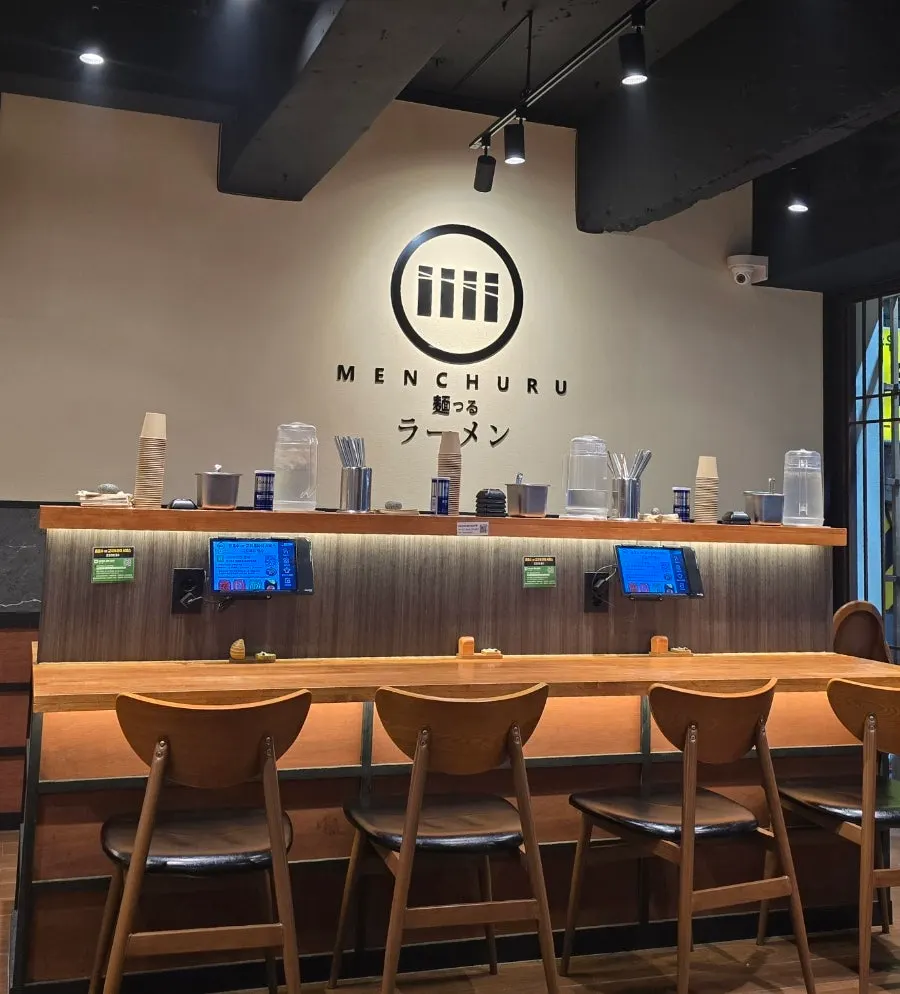 Side-by-side bar seating near the entrance
