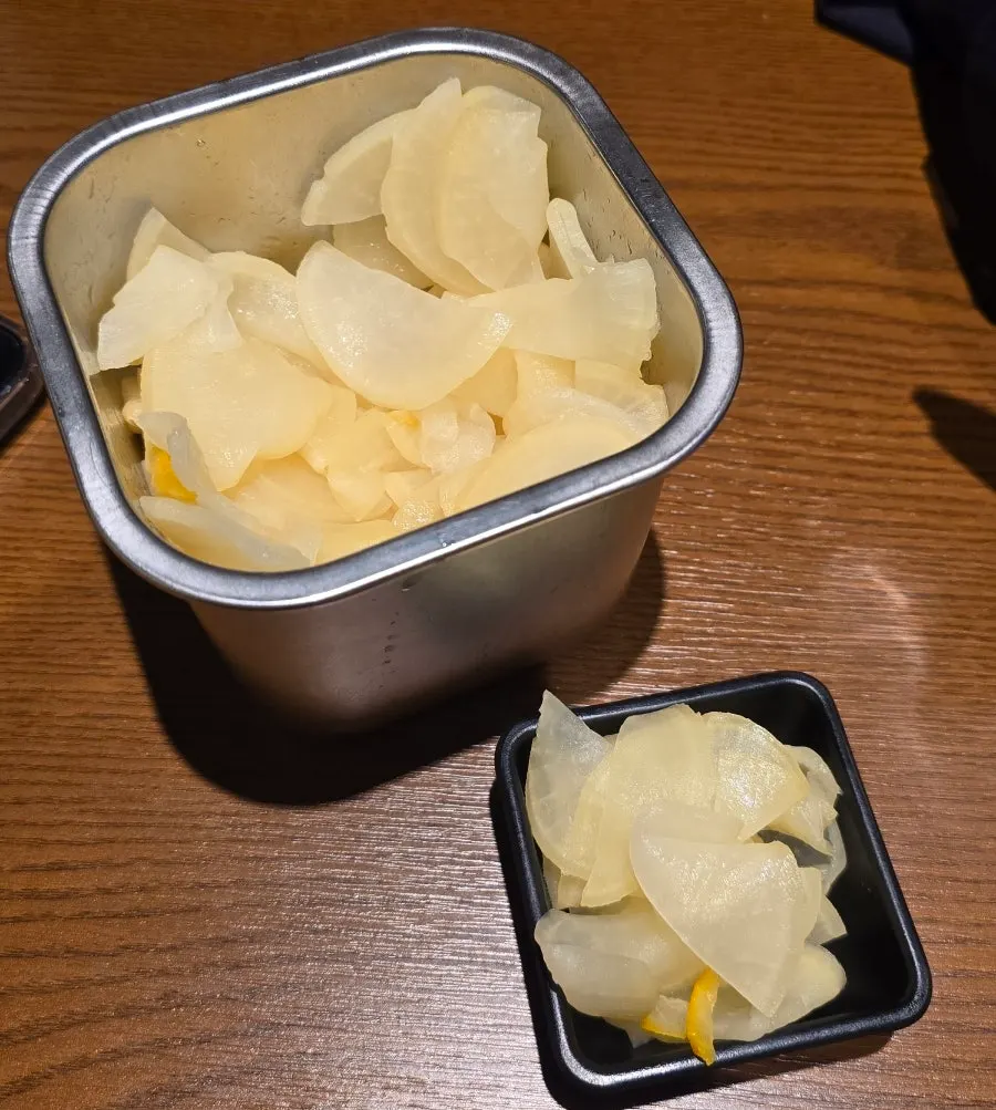 Self-serve yuzu pickled radish and table setting