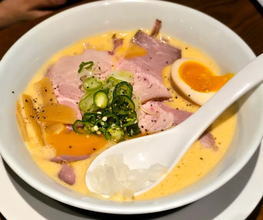 A bowl of tori paitan ramen with milky broth