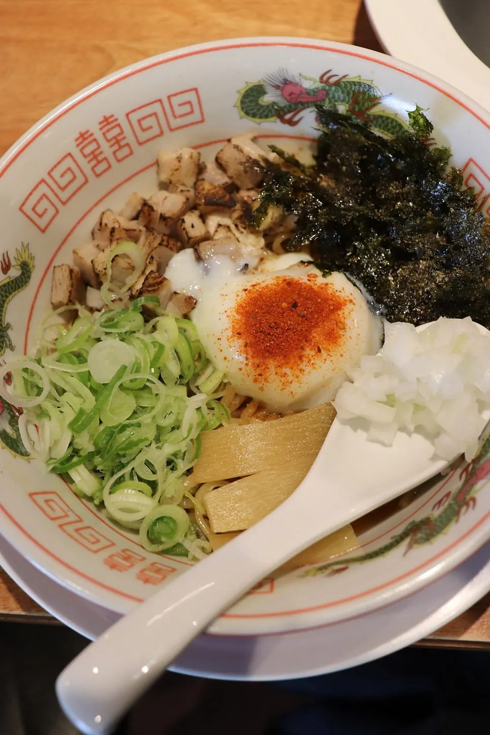 Close-up of abura soba topped with a soft-boiled egg