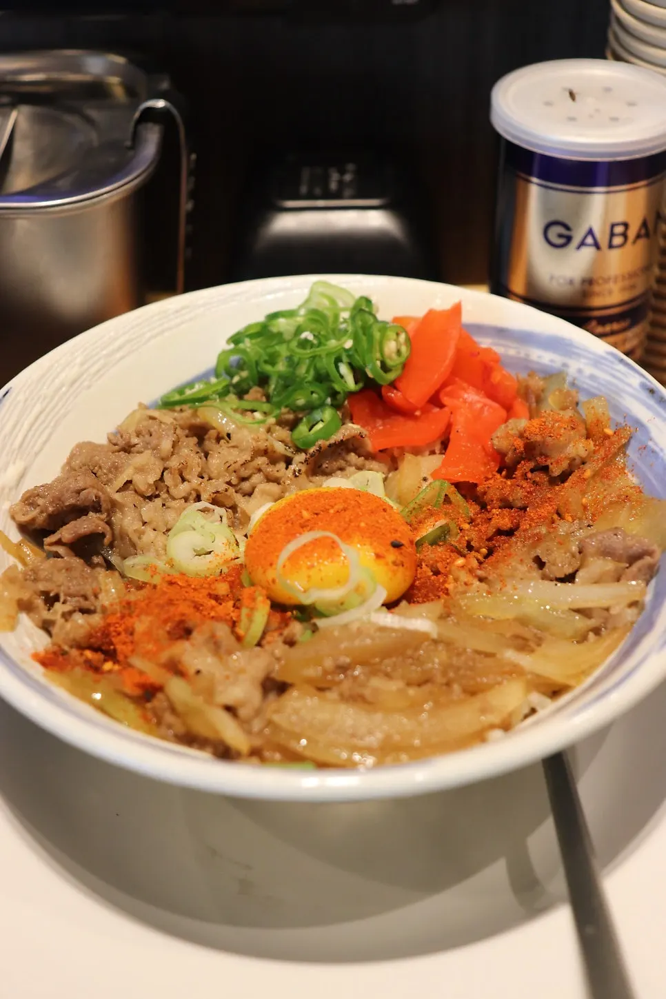 Close-up of thin beef short rib on the gyudon
