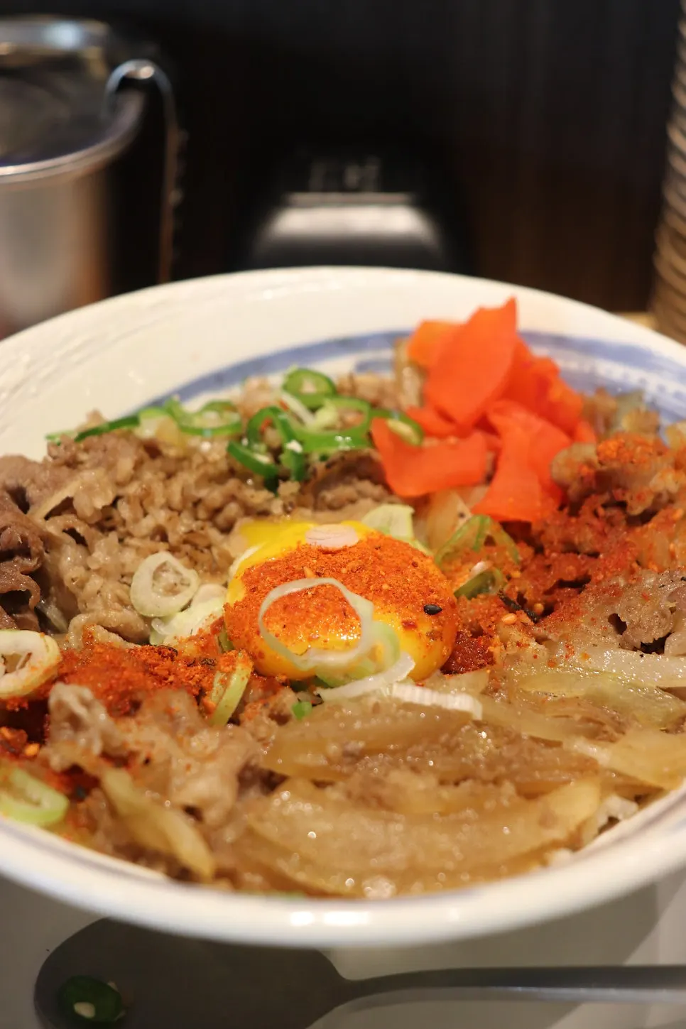Gyudon topped with pickled ginger and scallion