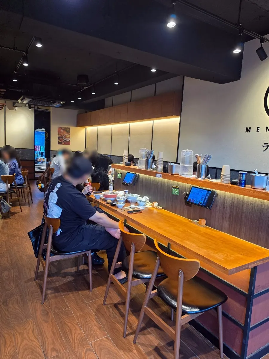 Mentsuru seating with generous spacing between tables