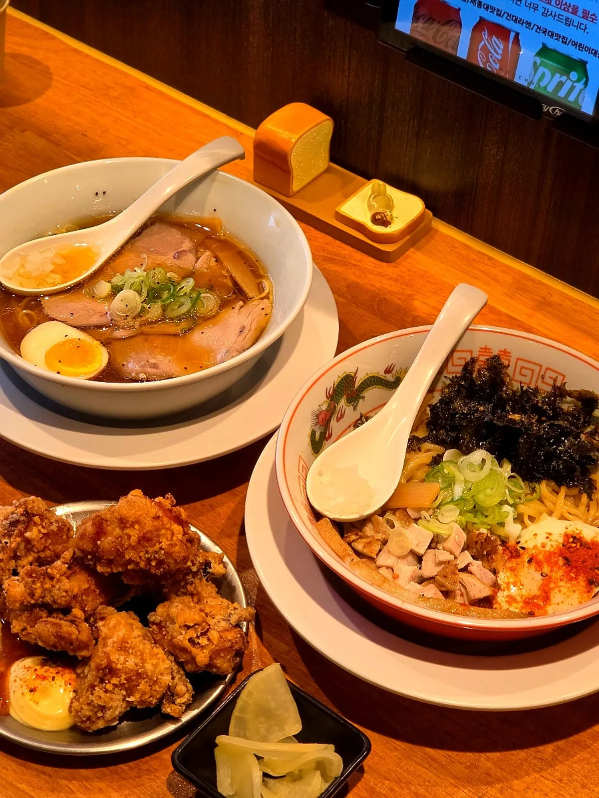 Table set with shoyu ramen and abura soba