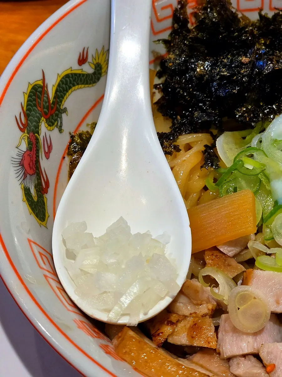 Abura soba topped with minced meat, seaweed, and poached egg