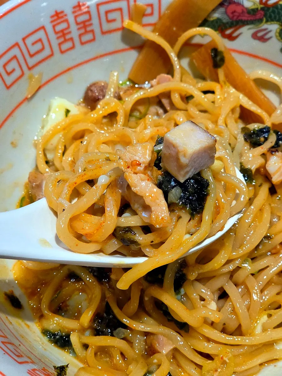 Chashu lifted together with the noodles