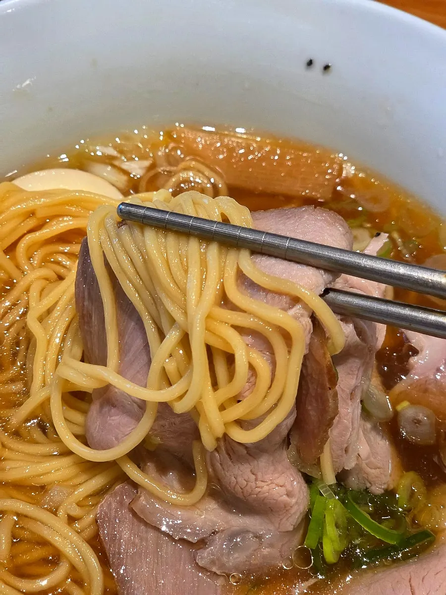 A spoonful of shoyu ramen broth