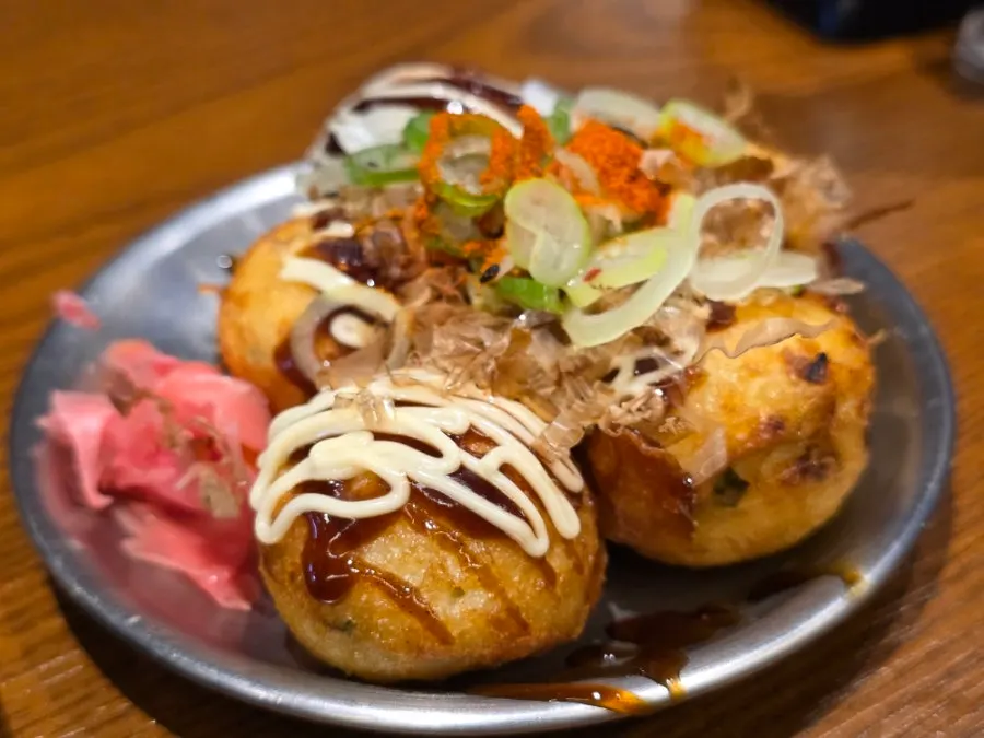 A plate of 5-piece takoyaki served first
