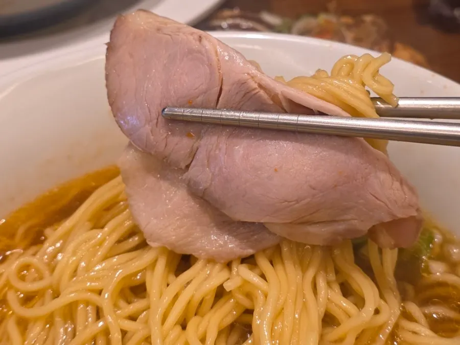 Spicy shoyu ramen topped with a large piece of chashu