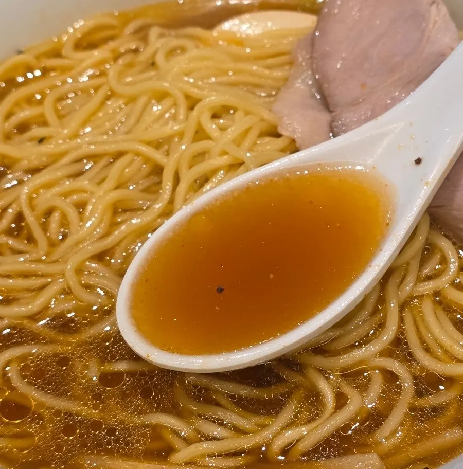 Spicy shoyu ramen broth made with clam and chicken stock