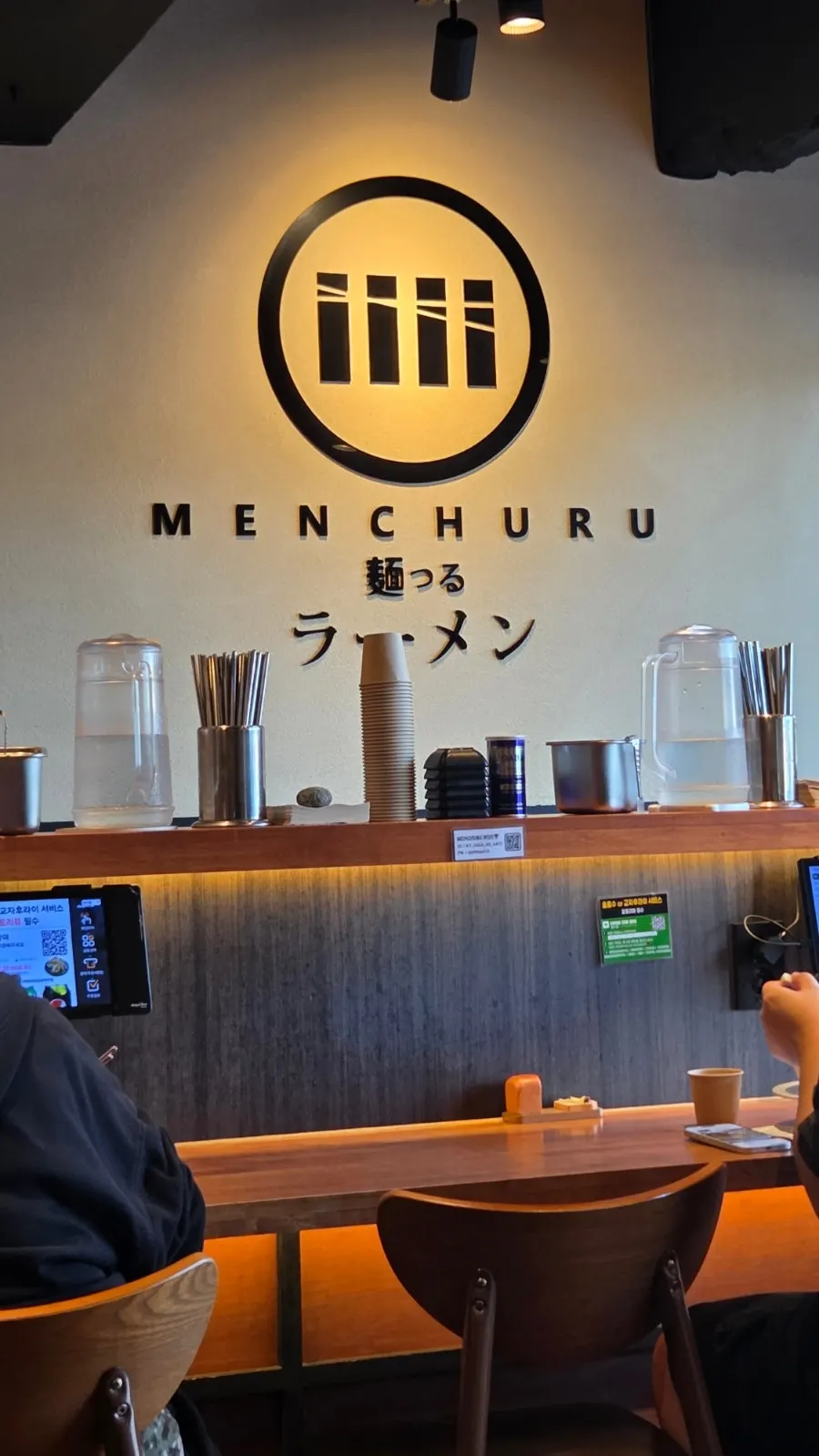 View of the bar seats facing the hall