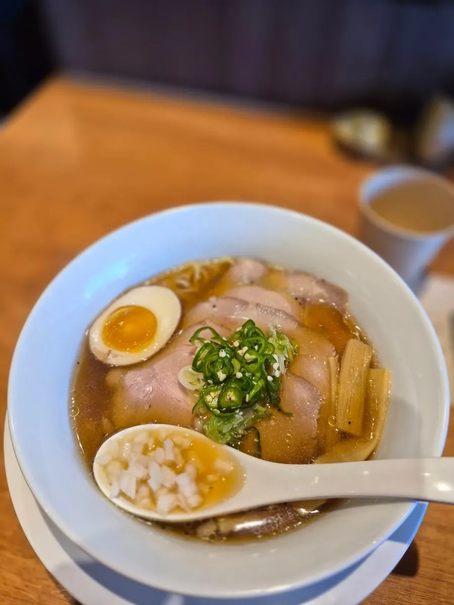 Shoyu ramen topped with chashu, egg and menma