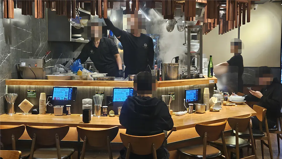 Bar-style seating with bright interior lighting