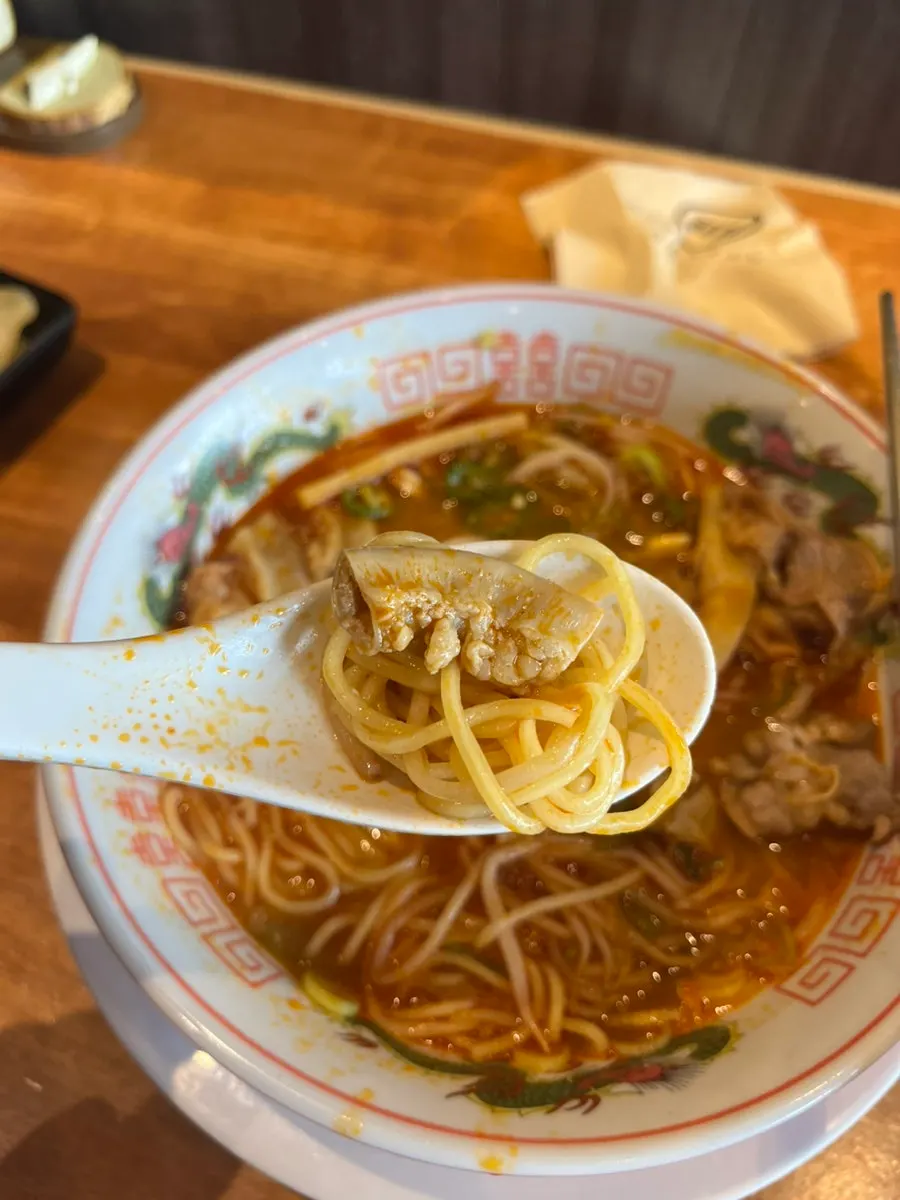 A bite of noodles and offal together