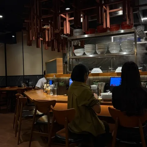Mentsuru's interior featuring wood tones and dark colors