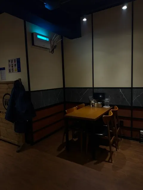 Solo-dining bar seats with phone stands