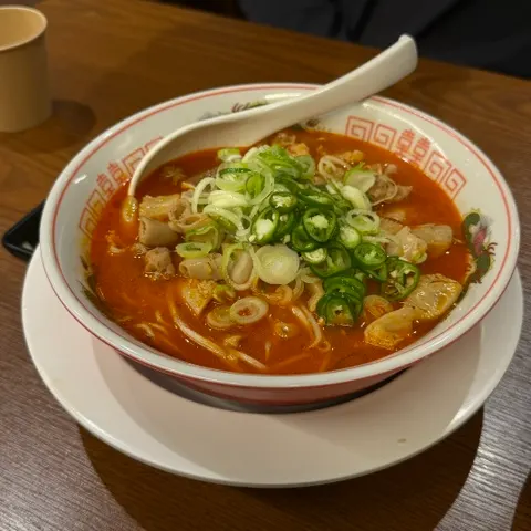 A bowl of motsu ramen topped with plenty of green onion
