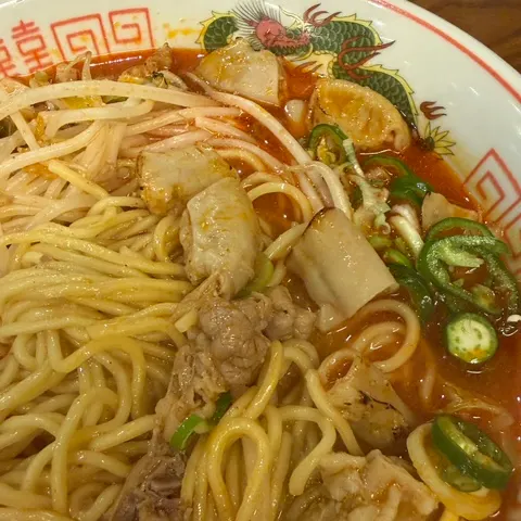 Generous torch-grilled beef intestine on top of the broth
