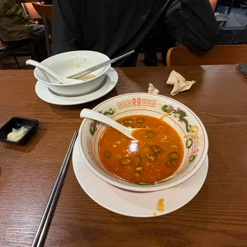 A ramen bowl emptied down to the broth