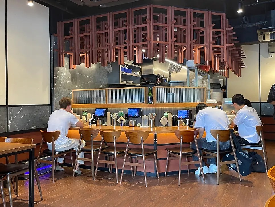 Interior of Mentsuru with tables and bar seating